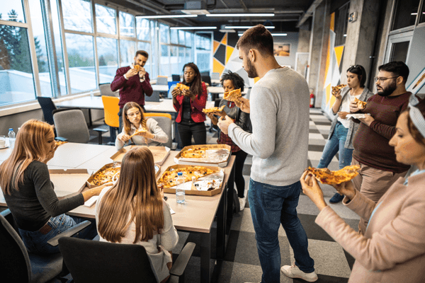 Colleagues enjoying pizza